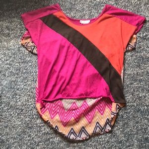 A pink, orange, yellow, brown and tan top.